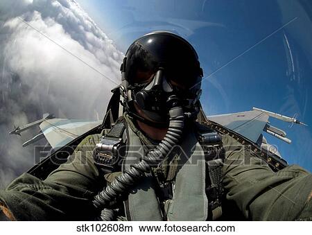 Picture - A pilot in the cockpit of an F-16 Fighting Falcon.. Fotosearch