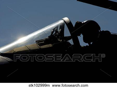 A pilot prepares for take-off. View Large Photo Image Picture - A pilot prepares for take-off.. Fotosearch