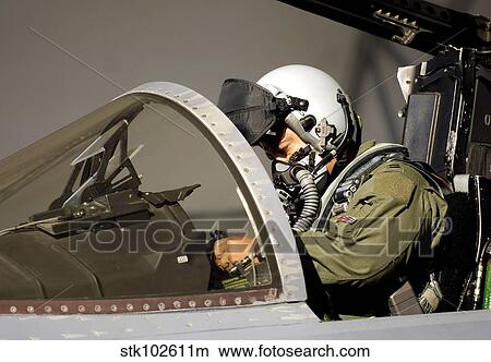 A pilot prepares his F-15A Eagle. View Large Photo Image Picture - A pilot prepares his F-15A Eagle.. Fotosearch