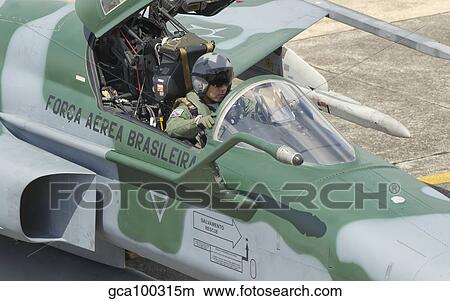 A pilot sitting in the cockpit of a Brazilian Air Force F-5 aircraft. View Large Photo Image Picture - A pilot sitting in the cockpit of a Brazilian Air Force F-5 aircraft.. Fotosearch