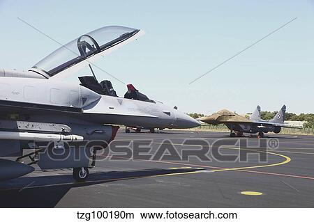 A Polish Air Force F-16D and MiG-29 aircraft, Albacete Air Base, Spain. View Large Photo Image Picture - A Polish Air Force F-16D and MiG-29 aircraft, Albacete Air Base, Spain.. Fotosearch