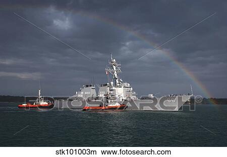 Picture - A rainbow arches over the guided missile destroyer USS Gonzalez.. Fotosearch