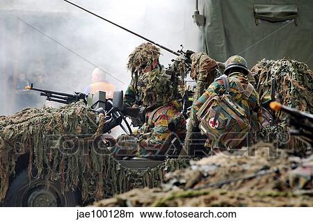 A recce or scout team of the Belgian Army in action. View Large Photo Image Picture - A recce or scout team of the Belgian Army in action.. Fotosearch