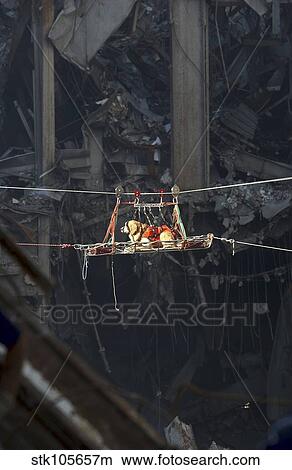 A rescue dog is transported out of the debris of the World Trade Center. View Large Photo Image Picture - A rescue dog is transported out of the debris of the World Trade Center.. Fotosearch