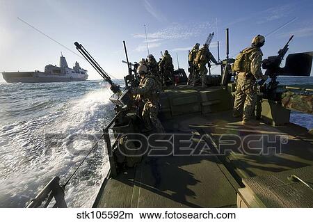 A Riverine Squadron conducts security escort operations. View Large Photo Image Picture - A Riverine Squadron conducts security escort operations.. Fotosearch