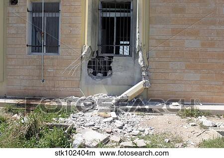 A Rocket Propelled Grenade damaged this portion of the wall. View Large Photo Image Picture - A Rocket Propelled Grenade damaged this portion of the wall.. Fotosearch