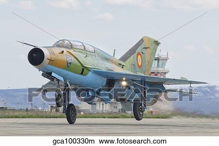Picture - A Romanian Air Force MiG-21B taking off from Camp Turzii Air Base, Romania.. Fotosearch
