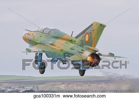 A Romanian Air Force MiG-21B taking off from Camp Turzii Air Base, Romania. View Large Photo Image Picture - A Romanian Air Force MiG-21B taking off from Camp Turzii Air Base, Romania.. Fotosearch