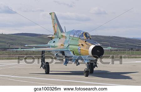 A Romanian Air Force MiG-21B taxiing at Camp Turzii Air Base, Romania. View Large Photo Image Picture - A Romanian Air Force MiG-21B taxiing at Camp Turzii Air Base, Romania.. Fotosearch