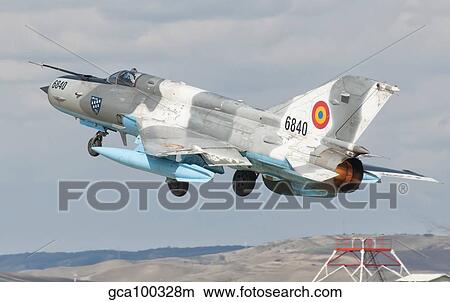 A Romanian Air Force MiG-21C taking off from Camp Turzii Air Base, Romania. View Large Photo Image Picture - A Romanian Air Force MiG-21C taking off from Camp Turzii Air Base, Romania.. Fotosearch