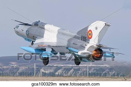 A Romanian Air Force MiG-21C taking off from Camp Turzii Air Base, Romania. View Large Photo Image Picture - A Romanian Air Force MiG-21C taking off from Camp Turzii Air Base, Romania.. Fotosearch