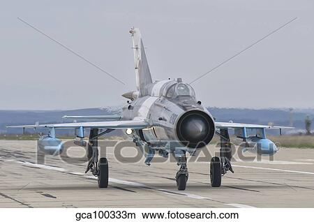 A Romanian Air Force MiG-21C taxiing at Camp Turzii Air Base, Romania. View Large Photo Image Picture - A Romanian Air Force MiG-21C taxiing at Camp Turzii Air Base, Romania.. Fotosearch