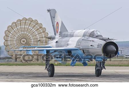 A Romanian Air Force MiG-21C with parachute deployed. View Large Photo Image Picture - A Romanian Air Force MiG-21C with parachute deployed.. Fotosearch