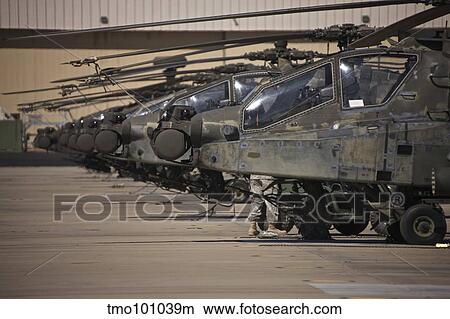 A row of AH-64D Apache helicopters at Pinal Airpark, Arizona. View Large Photo Image Picture - A row of AH-64D Apache helicopters at Pinal Airpark, Arizona.. Fotosearch