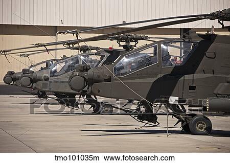 A row of AH-64D Apache Longbow helicopters. View Large Photo Image Picture - A row of AH-64D Apache Longbow helicopters.. Fotosearch