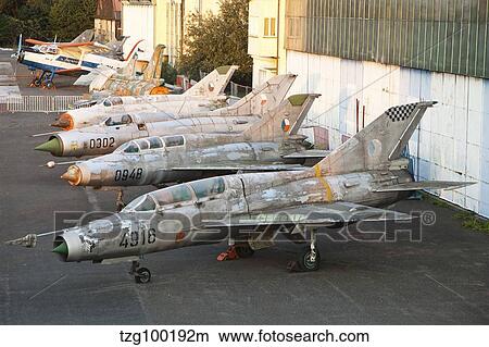 A row of derelict MiG aircraft of the Czech Air Force. View Large Photo Image Picture - A row of derelict MiG aircraft of the Czech Air Force.. Fotosearch
