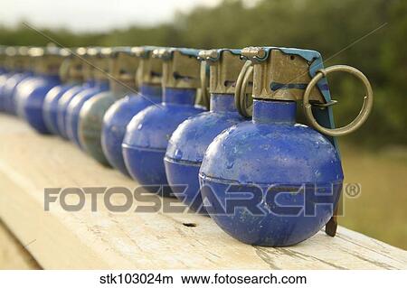 A row of M-67 training grenades. View Large Photo Image Picture - A row of M-67 training grenades.. Fotosearch