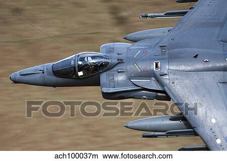 A Royal Air Force Harrier GR9 flying low over North Wales. View Large Photo Image Picture - A Royal Air Force Harrier GR9 flying low over North Wales.. Fotosearch