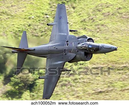A Royal Air Force Harrier GR9 flying low over North Wales. View Large Photo Image Picture - A Royal Air Force Harrier GR9 flying low over North Wales.. Fotosearch