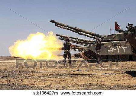 Picture - A Royal Jordanian Land Force Challenger 1 tank fires on a target.. Fotosearch