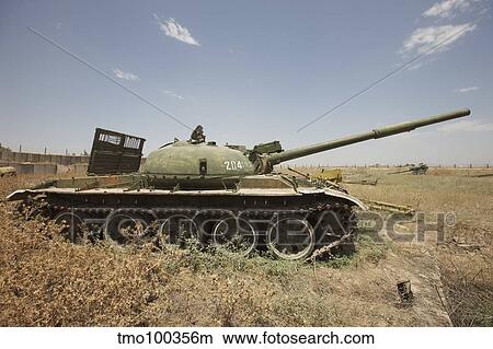 A Russian T-62 main battle tank rests in an armor junkyard. View Large Photo Image Picture - A Russian T-62 main battle tank rests in an armor junkyard.. Fotosearch