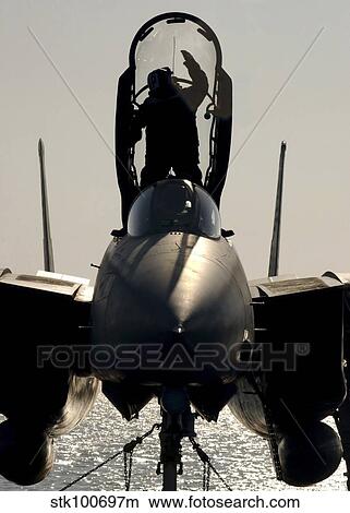 A Sailor cleans the canopy of a F-14B Tomcat. View Large Photo Image Picture - A Sailor cleans the canopy of a F-14B Tomcat.. Fotosearch