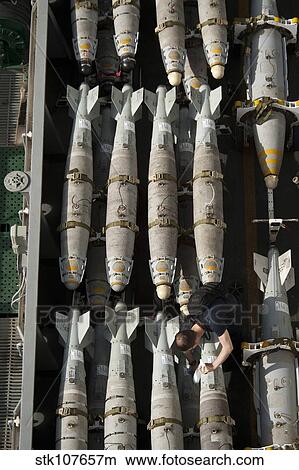 A Sailor maintains and cleans ordnance aboard USS Nimitz. View Large Photo Image Picture - A Sailor maintains and cleans ordnance aboard USS Nimitz.. Fotosearch