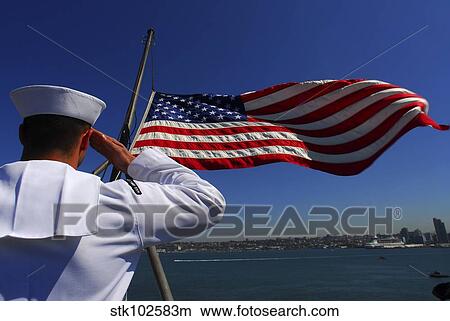 Picture - A sailor salutes the American flag.. Fotosearch