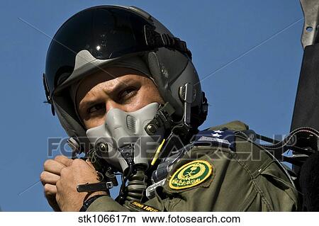 A Saudi Air Force pilot adjusts his flight helmet before a mission. View Large Photo Image Picture - A Saudi Air Force pilot adjusts his flight helmet before a mission.. Fotosearch