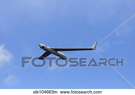 A Scan Eagle Unmanned Aerial Vehicle makes an arrested recovery on the Skyhook recovery system. View Large Photo Image Picture - A Scan Eagle Unmanned Aerial Vehicle makes an arrested recovery on the Skyhook recovery system.. Fotosearch