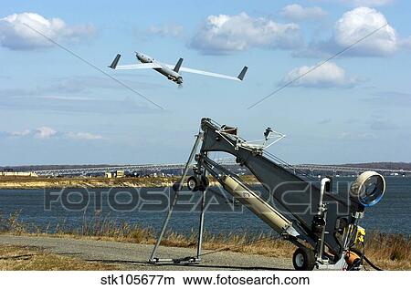 A ScanEagle unmanned aerial vehicle launches from a catapult. View Large Photo Image Picture - A ScanEagle unmanned aerial vehicle launches from a catapult.. Fotosearch