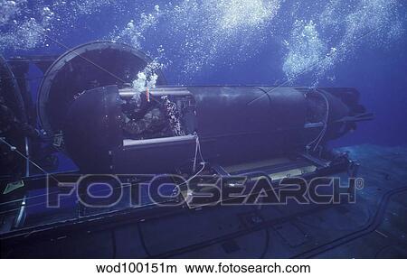 A SEAL Delivery Vehicle navigates onto the Dry Deck Shelter on USS Kamehameha. View Large Photo Image Picture - A SEAL Delivery Vehicle navigates onto the Dry Deck Shelter on USS Kamehameha.. Fotosearch