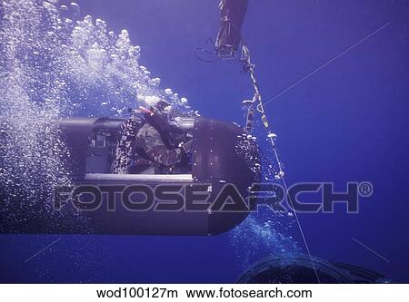 Picture - A SEAL Delivery Vehicle on tether with a buoy recovery line.. Fotosearch