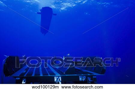 A SEAL Delivery Vehicle rendezvous with a submarine. View Large Photo Image Picture - A SEAL Delivery Vehicle rendezvous with a submarine.. Fotosearch