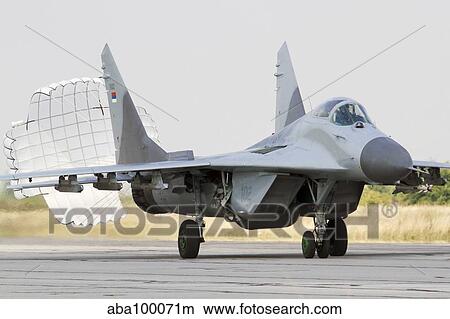 A Serbian Air Force MiG-29 with brake chute deployed. View Large Photo Image Picture - A Serbian Air Force MiG-29 with brake chute deployed.. Fotosearch