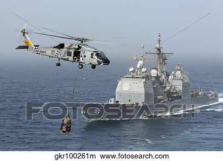 A SH-60J Seahawk flys by USS Vicksburg during a vertical replenishment. View Large Photo Image Picture - A SH-60J Seahawk flys by USS Vicksburg during a vertical replenishment.. Fotosearch