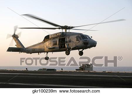 A Sikorsky SH-60F Seahawk lands on the flight deck of USS Dwight D. Eisenhower. View Large Photo Image Picture - A Sikorsky SH-60F Seahawk lands on the flight deck of USS Dwight D. Eisenhower.. Fotosearch