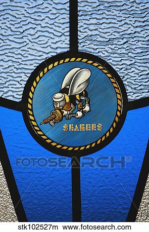 Picture - A single Seabee logo built into a stained-glass window.. Fotosearch