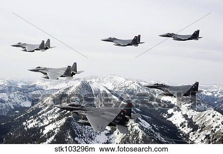 Picture - A six-ship formation of aircraft fly over the Sawtooth Mountains in Idaho.. Fotosearch