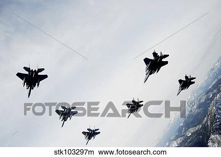 A six-ship formation of aircraft fly over the Sawtooth Mountains in Idaho. View Large Photo Image Picture - A six-ship formation of aircraft fly over the Sawtooth Mountains in Idaho.. Fotosearch