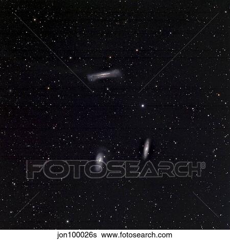 A small group of galaxies known as the Leo Triplet. View Large Photo Image Stock Photograph - A small group of galaxies known as the Leo Triplet.. Fotosearch