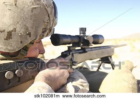 A soldier aims in with his M40A3 Scout Sniper Rifle. View Large Photo Image Picture - A soldier aims in with his M40A3 Scout Sniper Rifle.. Fotosearch