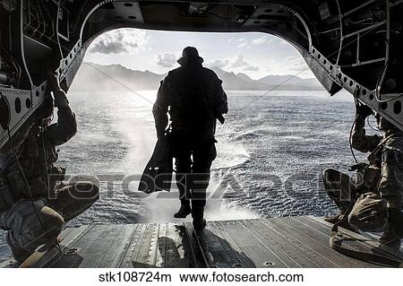 A soldier conducts a combat dive mission off the back of a CH-47 Chinook. View Large Photo Image Picture - A soldier conducts a combat dive mission off the back of a CH-47 Chinook.. Fotosearch