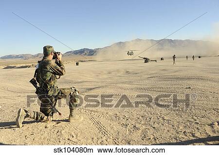 A soldier documents a CH-47 Chinook during a full-spectrum operations exercise. View Large Photo Image Picture - A soldier documents a CH-47 Chinook during a full-spectrum operations exercise.. Fotosearch