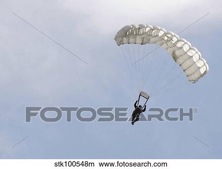 A soldier floats to the ground during High Altitude Low Opening training. View Large Photo Image Picture - A soldier floats to the ground during High Altitude Low Opening training.. Fotosearch