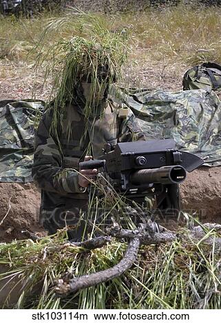 A soldier manning an MK-19 automatic crew serve grenade launcher during field training exercise Bearing Duel. View Large Photo Image Picture - A soldier manning an MK-19 automatic crew serve grenade launcher during field training exercise Bearing Duel.. Fotosearch