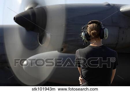 A soldier monitors the performance of a newly repaired C-130 Hercules engine. View Large Photo Image Picture - A soldier monitors the performance of a newly repaired C-130 Hercules engine.. Fotosearch