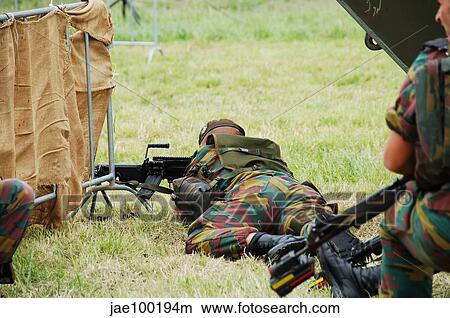 A soldier of the Belgian Army on guard with his FN Minimi rifle. View Large Photo Image Picture - A soldier of the Belgian Army on guard with his FN Minimi rifle.. Fotosearch