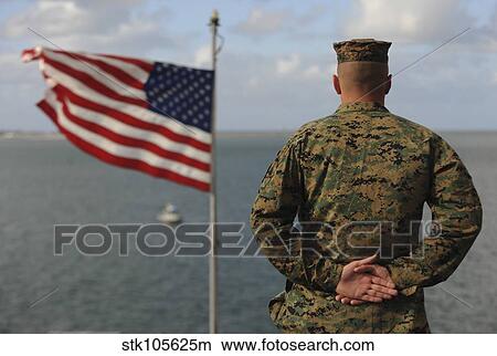 A soldier stands at attention on USS Bonhomme Richard. View Large Photo Image Picture - A soldier stands at attention on USS Bonhomme Richard.. Fotosearch