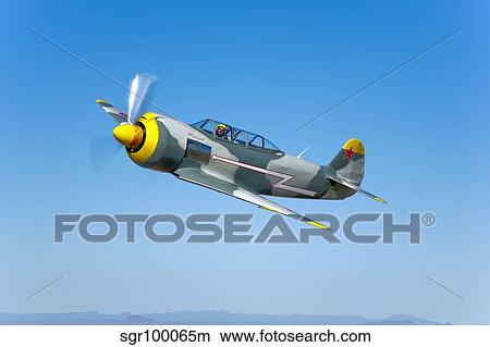 Picture - A Soviet Yakovlev Yak-11 aircraft in flight.. Fotosearch
